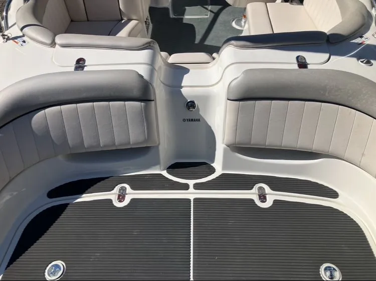 Slide: The Image of Interior of a 2009 Yamaha SX230 boat with gray seating. - 9