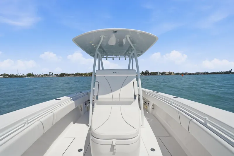 Slide: The Image of 2024 Contender 32 ST boat on water, featuring sleek design and spacious seating. - 16