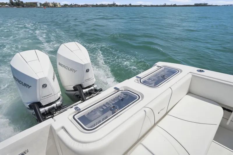 Slide: The Image of 2024 Contender 32 ST boat with dual Mercury engines on open water. - 19