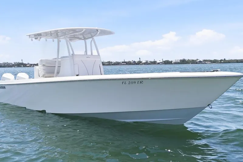 Slide: The Image of 2024 Contender 32 ST boat on water, showcasing sleek design and modern features. - 9