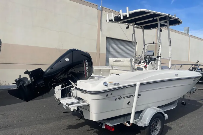 The Image of 2020 Bayliner Element F18 boat with Mercury outboard motor on trailer. - 0
