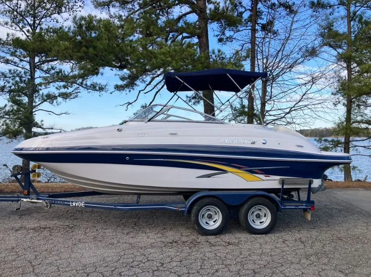 The Image of 2007 Four Winns 204 Funship boat on trailer by lake. - 0