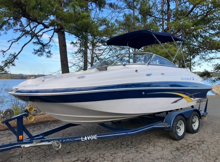 Slide: The Image of 2007 Four Winns 204 Funship boat on trailer by lake. - 1