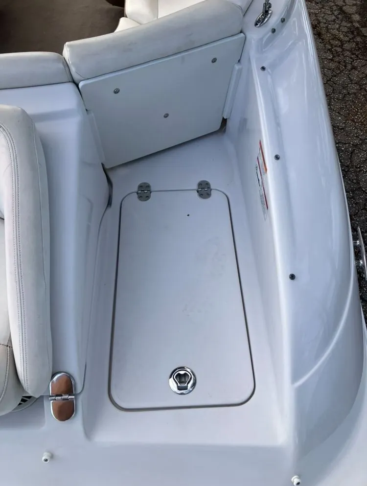 Slide: The Image of 2007 Four Winns 204 Funship boat deck with storage compartment. - 10