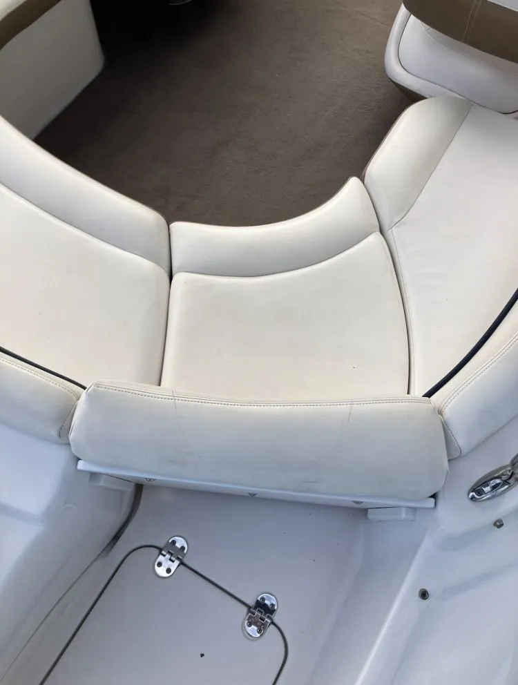 Slide: The Image of Interior of a 2007 Four Winns 204 Funship boat with white seating. - 11