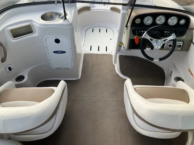 Slide: The Image of Interior of a 2007 Four Winns 204 Funship boat with steering wheel and seats. - 12
