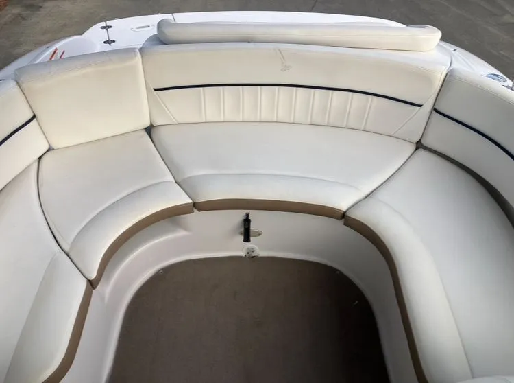 Slide: The Image of Interior of a 2007 Four Winns 204 Funship boat with white seating. - 21