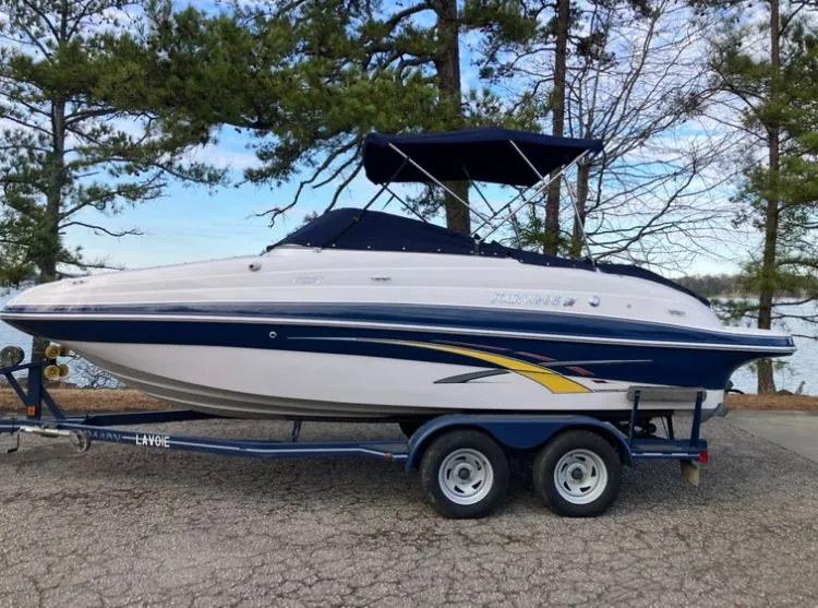 Slide: The Image of 2007 Four Winns 204 Funship boat on trailer by lake. - 25