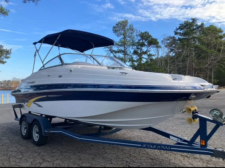 Slide: The Image of 2007 Four Winns 204 Funship on trailer, blue sky, trees in background. - 3