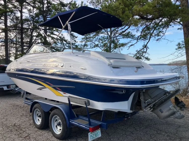 Slide: The Image of 2007 Four Winns 204 Funship boat on trailer by lake. - 7