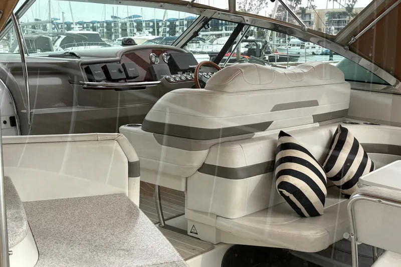 Slide: The Image of Interior of a 2004 Formula 41 Performance Cruiser with plush seating and striped cushions. - 10
