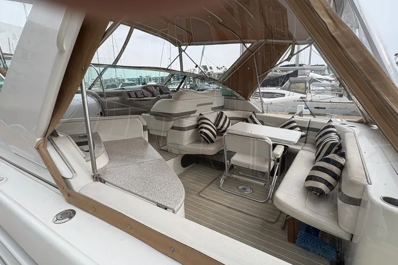 Slide: The Image of Luxurious 2004 Formula 41 Performance Cruiser interior with striped cushions and elegant seating. - 11