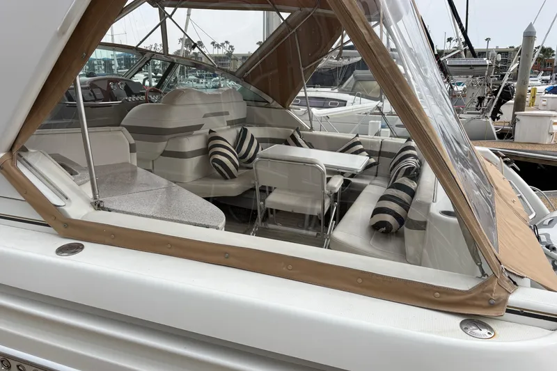 Slide: The Image of 2004 Formula 41 Performance Cruiser with striped cushions in marina setting. - 12