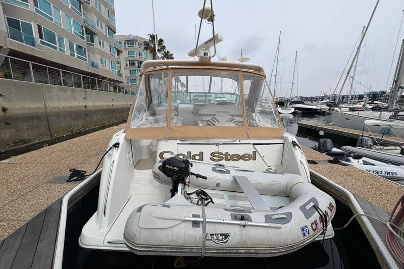 Slide: The Image of 2004 Formula 41 Performance Cruiser docked with inflatable boat attached. - 14