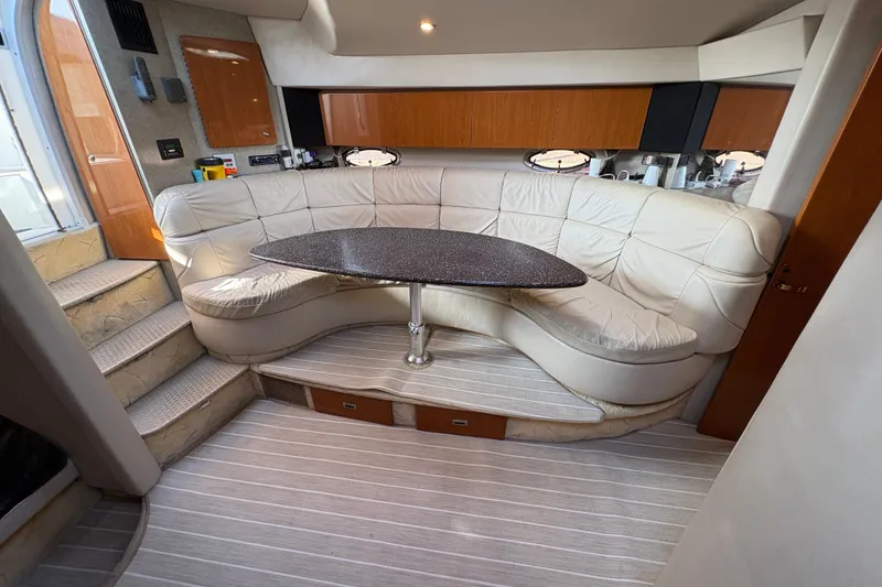 Slide: The Image of Luxurious interior of a 2004 Formula 41 Performance Cruiser with plush seating and elegant table. - 15