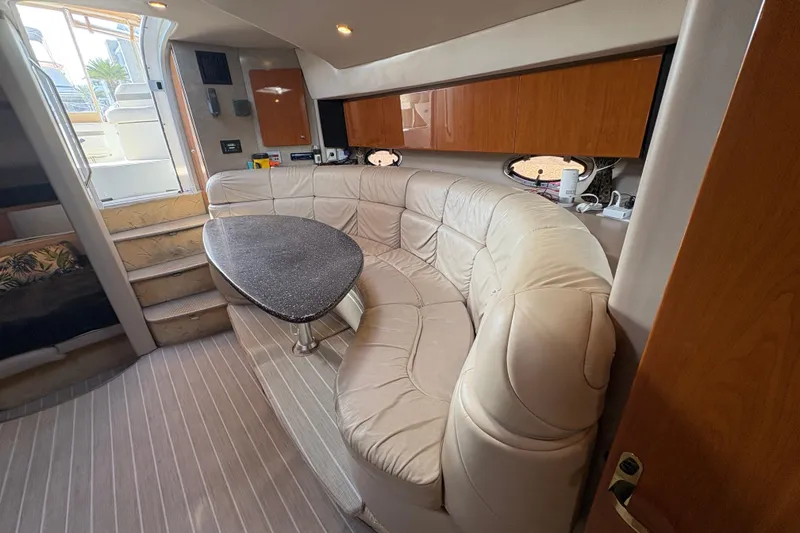 Slide: The Image of Luxurious interior of 2004 Formula 41 Performance Cruiser with leather seating and wooden cabinetry. - 18