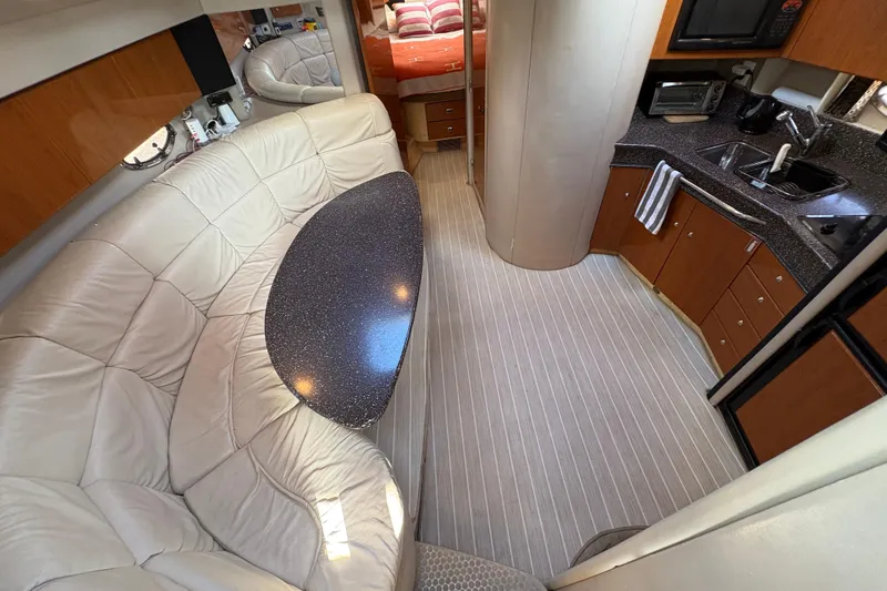 Slide: The Image of Interior of 2004 Formula 41 Performance Cruiser with kitchen and seating area. - 21