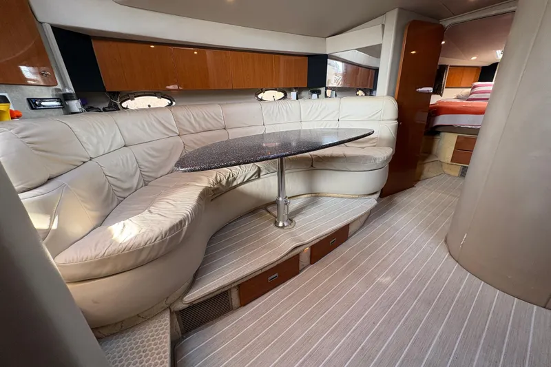Slide: The Image of Luxurious interior of a 2004 Formula 41 Performance Cruiser with plush seating and elegant table. - 22