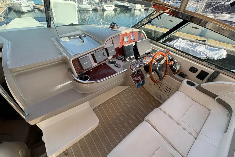 Slide: The Image of Cockpit of 2004 Formula 41 Performance Cruiser with steering wheel and navigation instruments. - 23