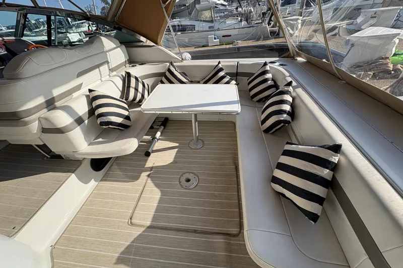 Slide: The Image of Luxurious 2004 Formula 41 Performance Cruiser interior with striped cushions and seating area. - 24