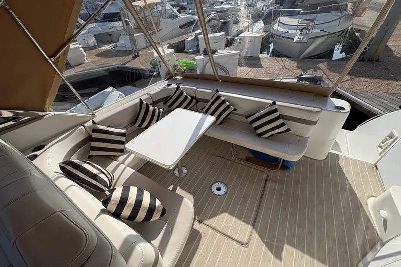 Slide: The Image of 2004 Formula 41 Performance Cruiser interior with striped cushions and seating area. - 26