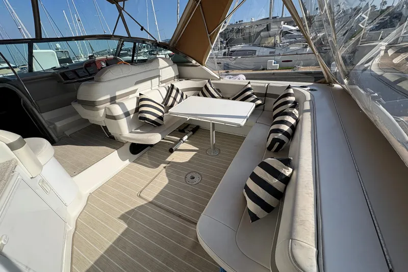 Slide: The Image of Luxurious 2004 Formula 41 Performance Cruiser interior with striped cushions and sleek seating. - 29