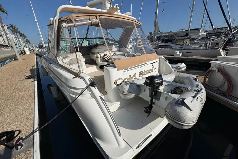 Slide: The Image of 2004 Formula 41 Performance Cruiser docked with inflatable boat attached. - 31