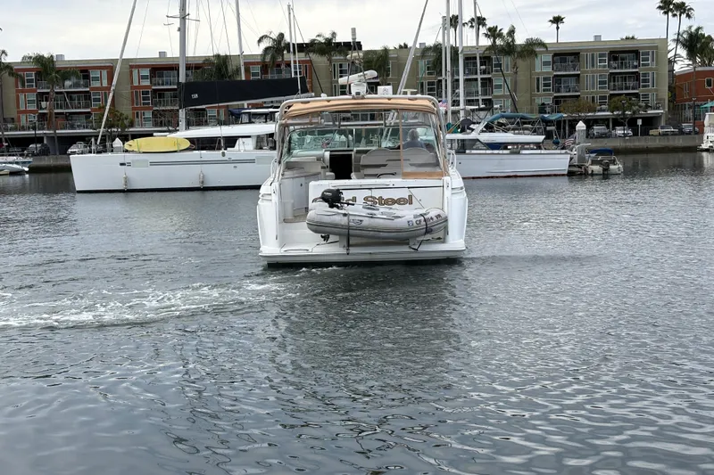 Slide: The Image of 2004 Formula 41 Performance Cruiser in marina, surrounded by sailboats and waterfront buildings. - 33