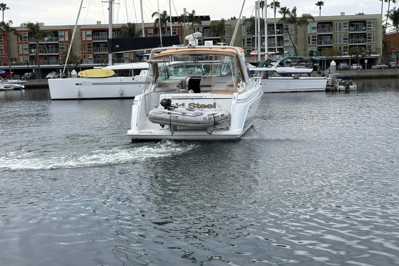 Slide: The Image of 2004 Formula 41 Performance Cruiser in marina, surrounded by boats and waterfront buildings. - 40