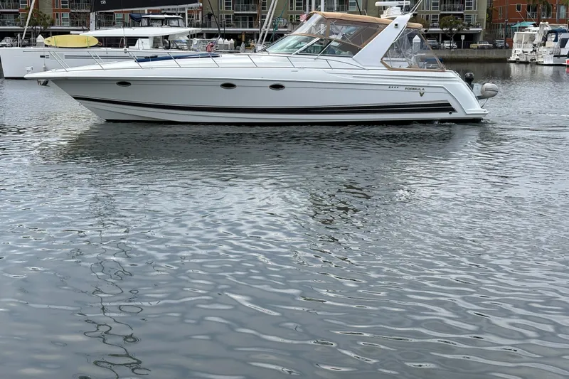 Slide: The Image of 2004 Formula 41 Performance Cruiser yacht docked in marina. - 47