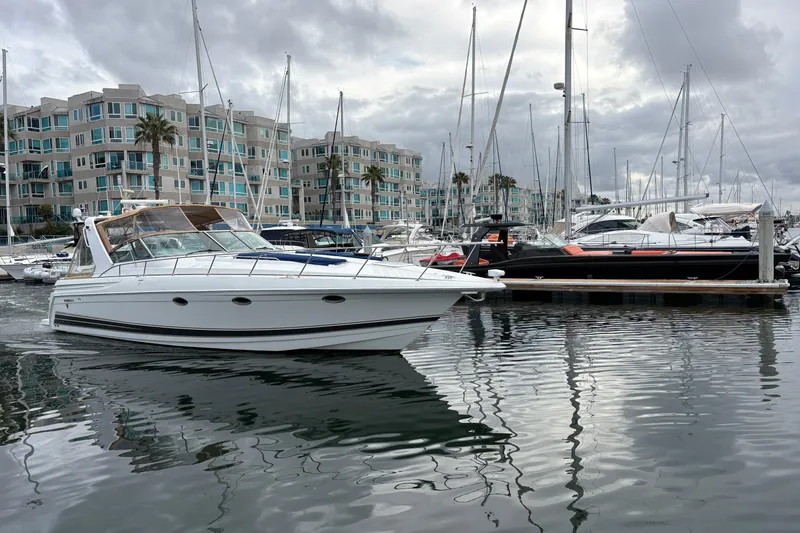 Slide: The Image of 2004 Formula 41 Performance Cruiser in marina, surrounded by modern waterfront buildings. - 48