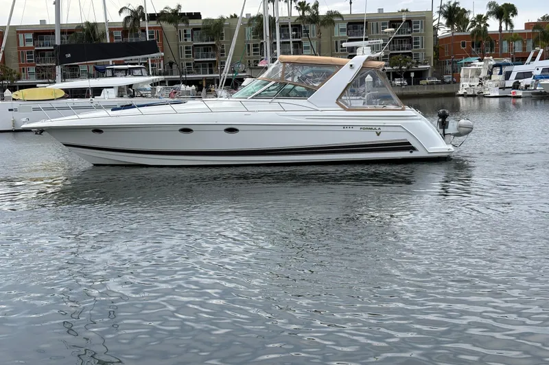 Slide: The Image of 2004 Formula 41 Performance Cruiser yacht docked in a marina. - 50