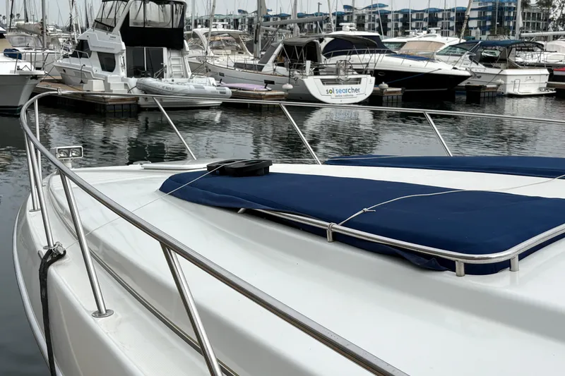 Slide: The Image of 2004 Formula 41 Performance Cruiser docked at marina with other boats. - 8