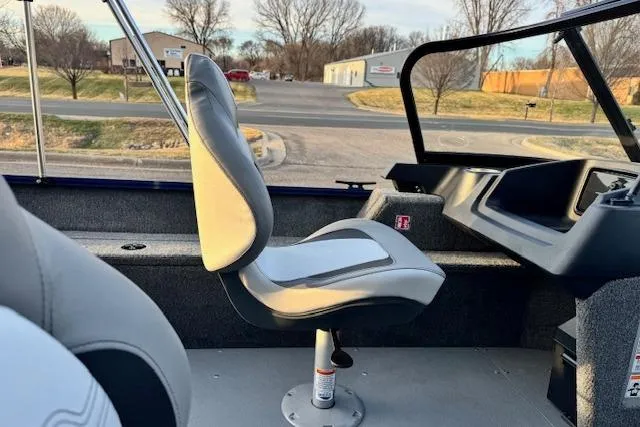 Slide: The Image of 2026 Princecraft Holiday 162 WS MAX boat interior with seating and console view. - 11