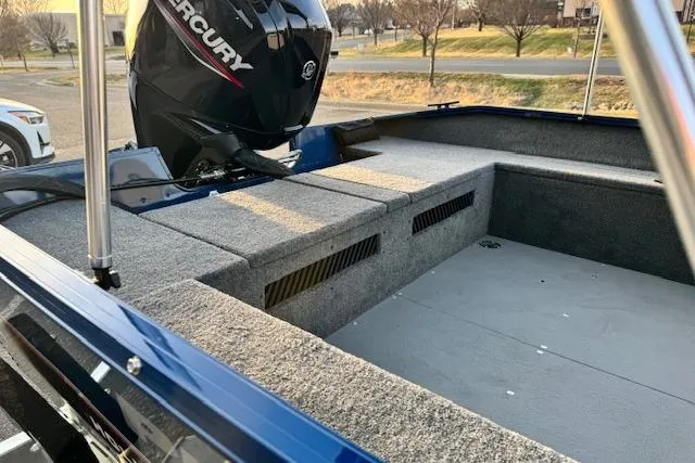 Slide: The Image of 2026 Princecraft Holiday 162 WS MAX boat interior with Mercury engine, showcasing spacious seating. - 12