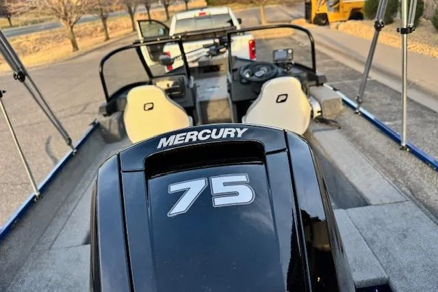 Slide: The Image of 2026 Princecraft Holiday 162 WS MAX boat with Mercury 75 engine, parked on trailer. - 15