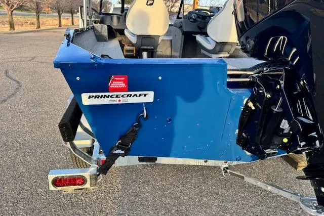 Slide: The Image of 2026 Princecraft Holiday 162 WS MAX boat rear view, showcasing blue exterior and interior seating. - 17