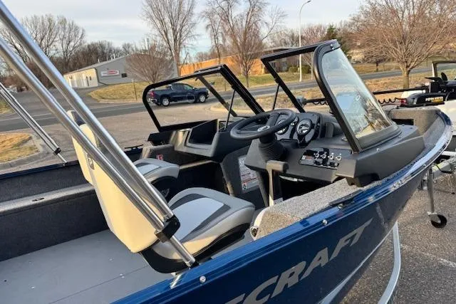 Slide: The Image of 2026 Princecraft Holiday 162 WS MAX boat interior with steering console and seating. - 5