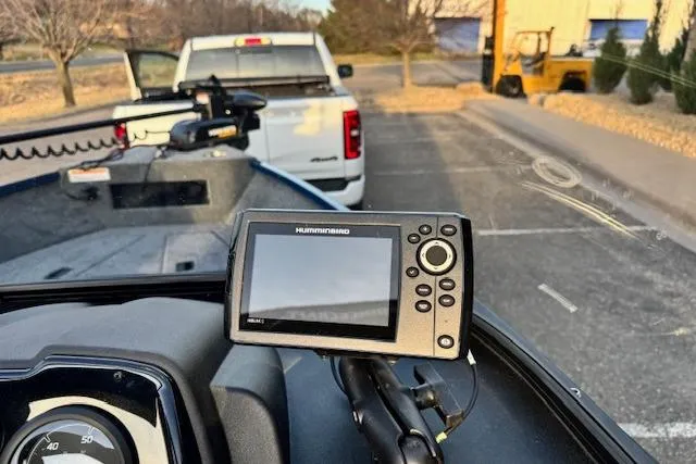 Slide: The Image of 2026 Princecraft Holiday 162 WS MAX boat with Humminbird fish finder, parked near a truck. - 7