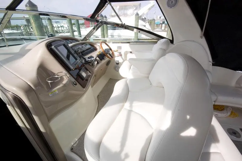 Slide: The Image of Interior of a 2002 Sea Ray 380 Sundancer yacht with white seating. - 9