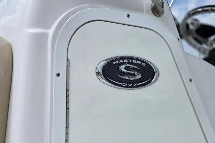 Slide: The Image of 2016 Sportmans Masters 227 Bay Boat emblem on white panel. - 19