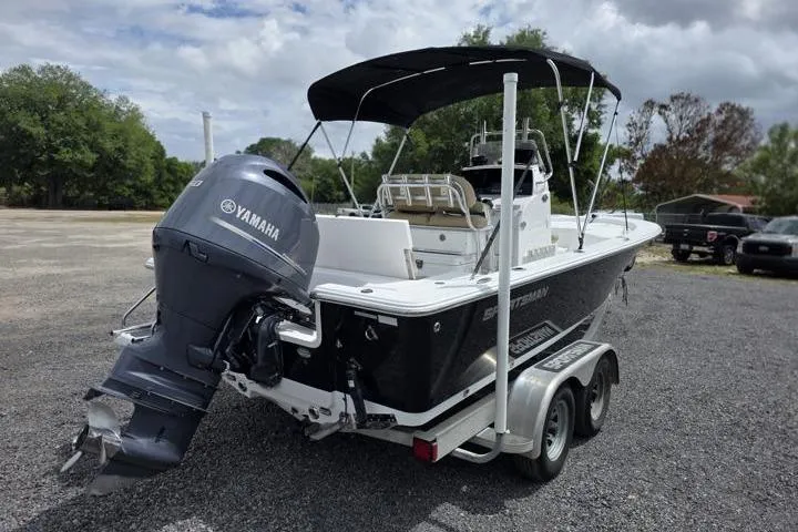 Slide: The Image of 2016 Sportmans Masters 227 Bay Boat with Yamaha engine on trailer, parked outdoors. - 5