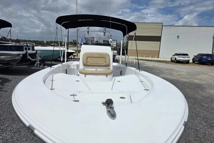 Slide: The Image of 2016 Sportmans Masters 227 Bay Boat with canopy, parked outdoors. - 8
