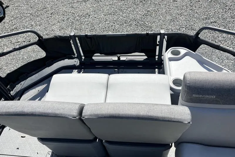 Slide: The Image of 2022 Sea-Doo Switch Cruise 21 interior with seating and cup holders. - 10