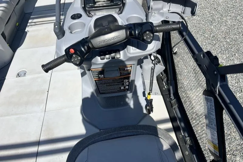 Slide: The Image of 2022 Sea-Doo Switch Cruise 21 steering console with controls and safety features. - 12