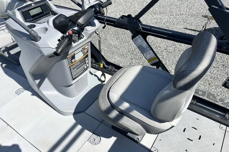 Slide: The Image of 2022 Sea-Doo Switch Cruise 21 helm with steering controls and comfortable seating. - 13
