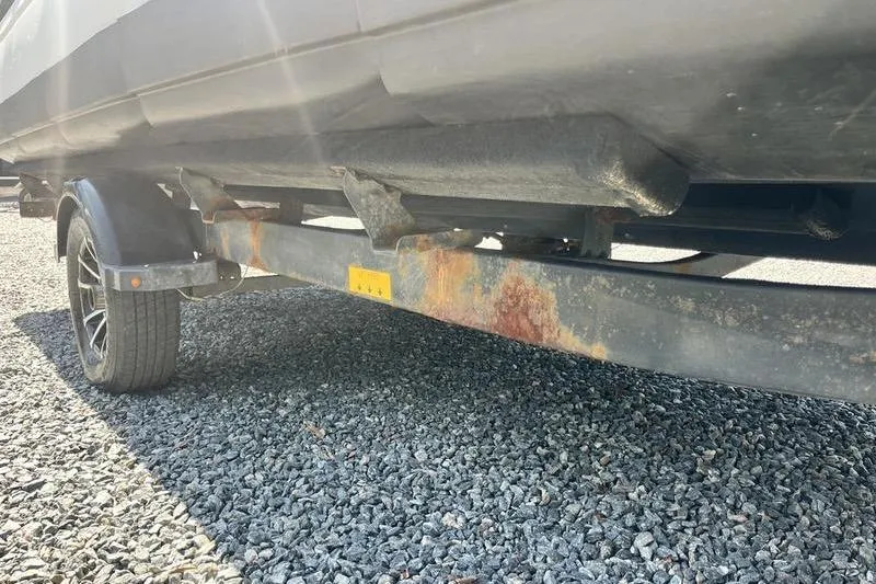 Slide: The Image of 2022 Sea-Doo Switch Cruise 21 trailer with visible rust on frame. - 14