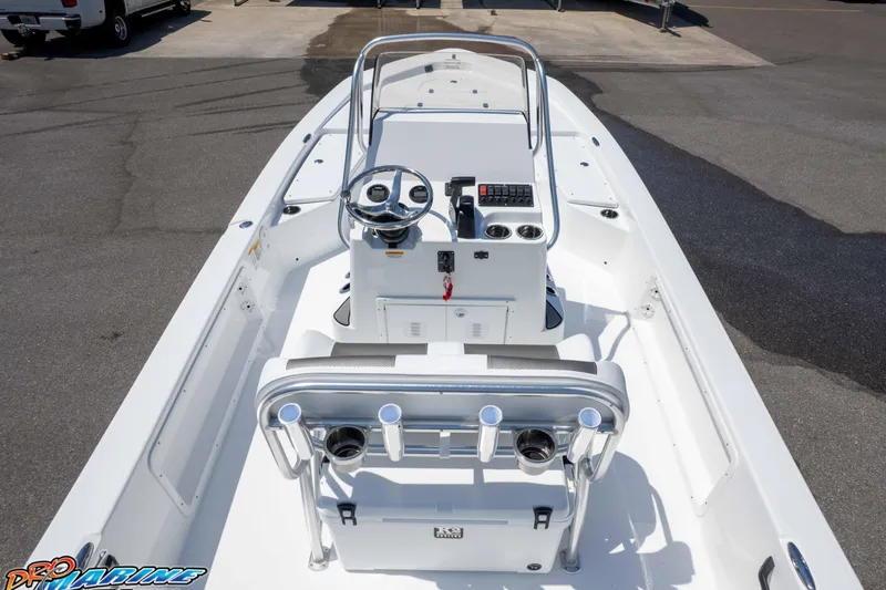 Slide: The Image of 2025 Frontier 2104 boat interior with steering console and seating, displayed outdoors. - 24