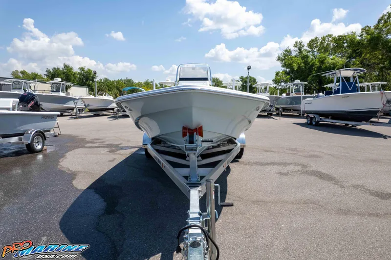 Slide: The Image of Frontier 2104 boat on trailer in sunny outdoor showroom, 2025 model. - 4
