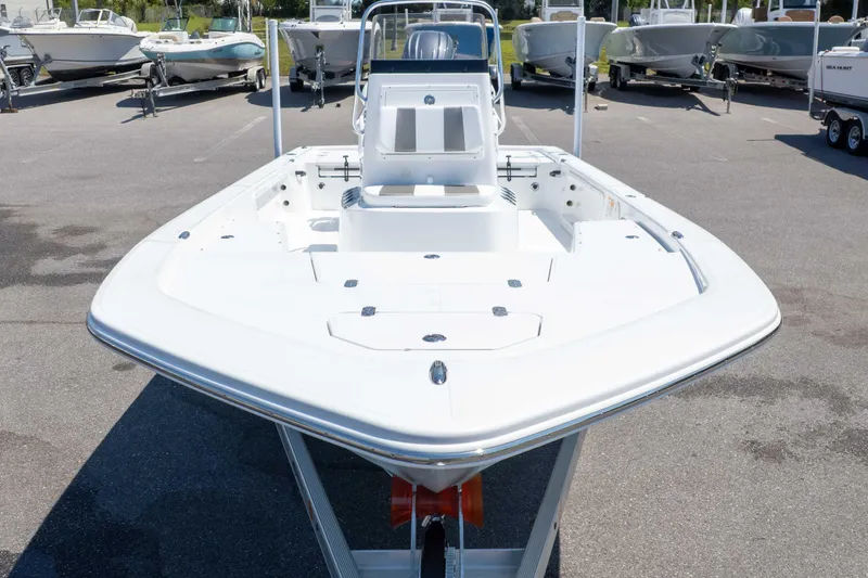 Slide: The Image of Front view of a 2025 Frontier 2104 boat on a trailer in a marina. - 5